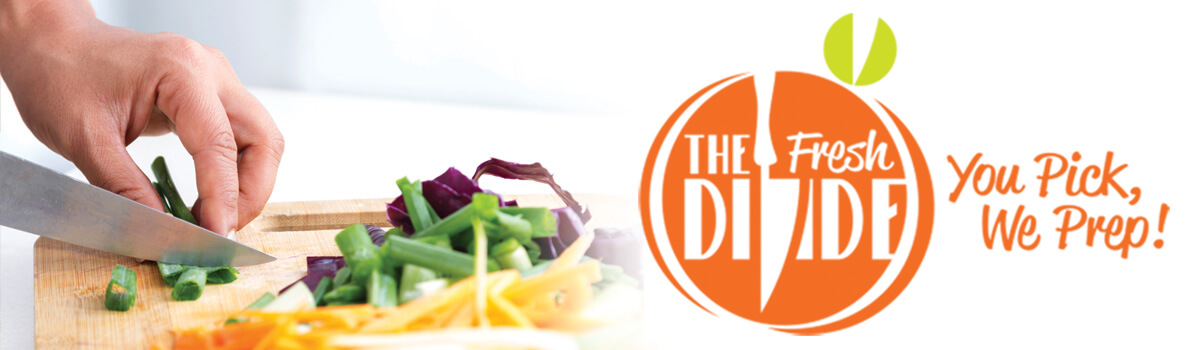 Person cutting vegetables on cutting board alongside The Fresh Divide logo